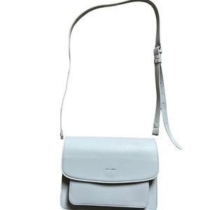 Blue/Grey crossbody with multiple compartments for travel.